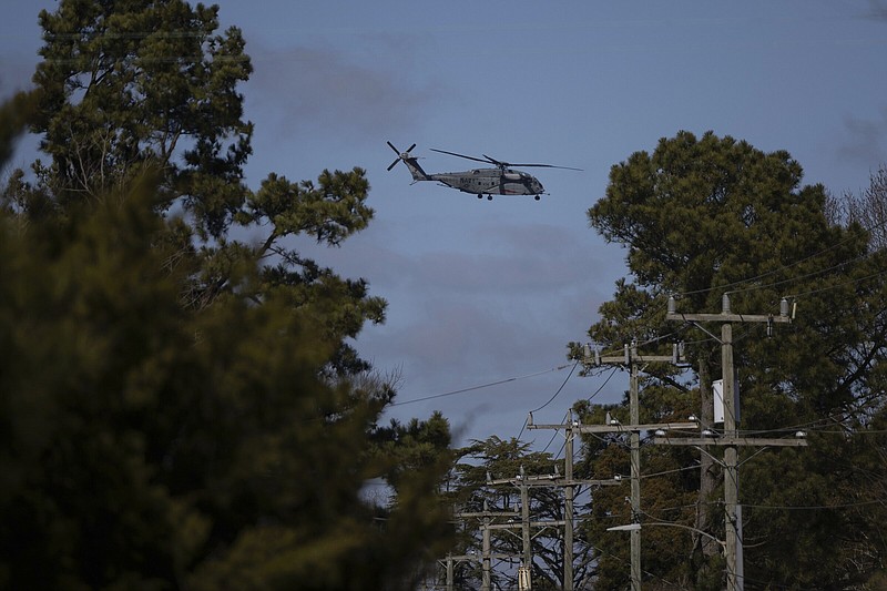 A U.S. Navy CH-53 Super Stallion helicopter flies near Naval Air Station Oceana in Virginia Beach, Va., on Thursday.
(AP/Tom Brenner)