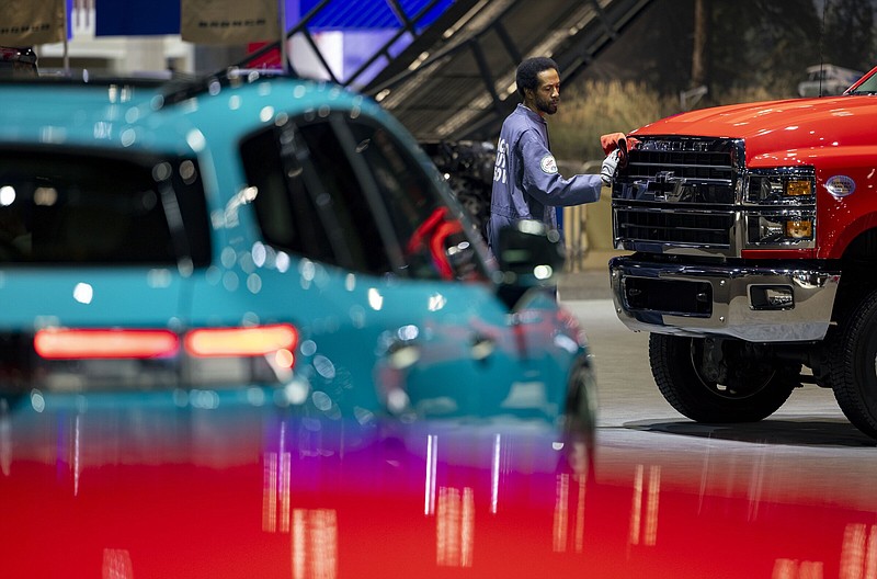 Chevrolet and Honda vehicles are prepared Thursday for display at the Chicago Auto Show preview day at McCormick Place.
(Chicago Tribune TNS/Brian Cassella)