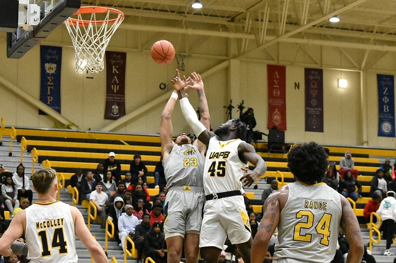 Eric Coleman (23) of Alabama State and Ismael Plet (45) of UAPB battle for a rebound in the first half Jan. 8 at H.O. Clemmons Arena. (Pine Bluff Commercial/I.C. Murrell)