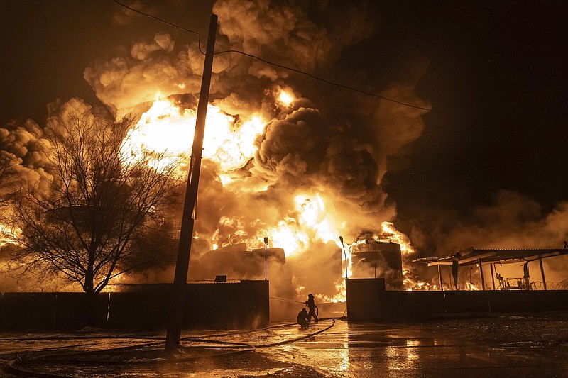Firefighters battle a fire on Saturday after a Russian attack on a residential neighborhood in Kharkiv, Ukraine. More photos at arkansasonline.com/ukrainemonth24/.
(AP/Yevhen Titov)