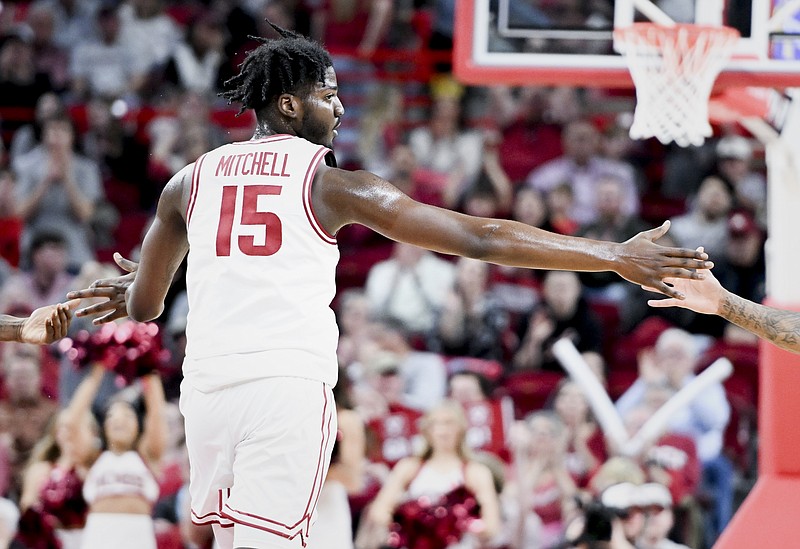 Arkansas forward Makhi Mitchell (15) high-fives a teamate, Saturday, February 10, 2024 during the second half of a basketball game at Bud Walton Arena in Fayetteville. Visit nwaonline.com/photos for today's photo gallery...(NWA Democrat-Gazette/Charlie Kaijo)