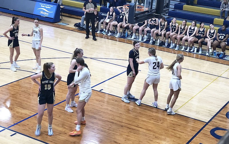 The Helias Lady Crusaders prepare to defend on an inbounds play during Friday night's game against Quincy Notre Dame at Rackers Fieldhouse. (Tom Rackers/News Tribune)
