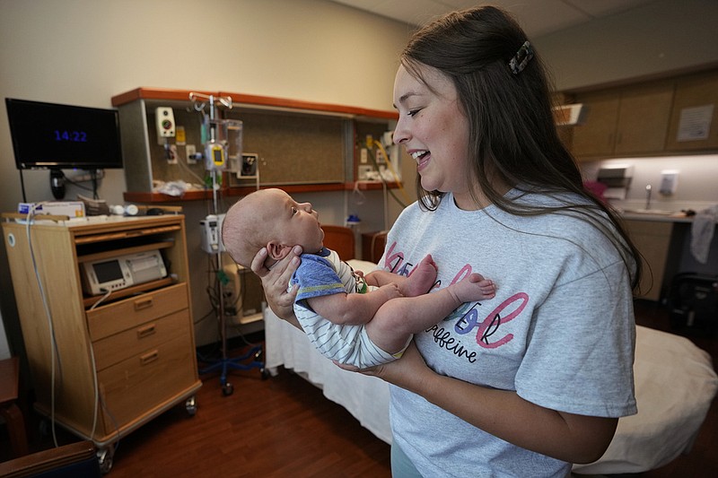 Katie O'Brien holds her son, Bennett, in the birthing room where she delivered him in July 2023 in this Aug. 29, 2023 file photo. (AP/Mark Humphrey)