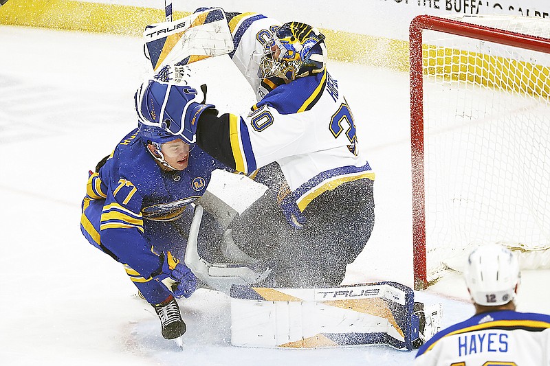 Sabres right wing JJ Peterka skates into Blues goaltender Joel Hofer during the third period of Saturday’s game in Buffalo, N.Y. (Associated Press)