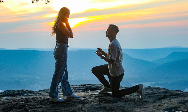 Staff file photo by Olivia Ross / Alex Tejera proposes to Jordan Guiou on Sunset Rock.