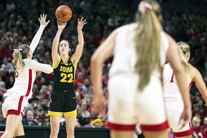 Iowa’s Caitlin Clark shoots against Nebraska’s Kendall Moriarty during the second half of Sunday afternoon’s game in Lincoln, Neb. (Associated Press)