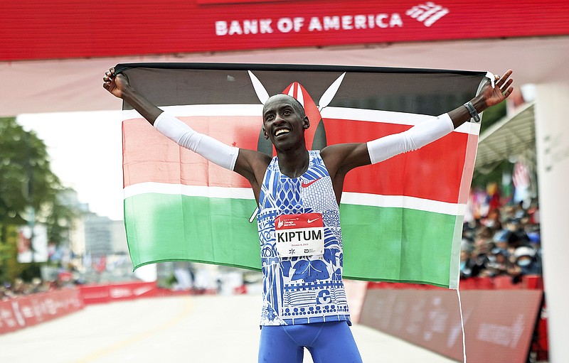 In this Oct. 8, 2023, file photo, Kelvin Kiptum of Kenya celebrates his Chicago Marathon world record victory in Chicago. (Chicago Tribune via the Associated Press)