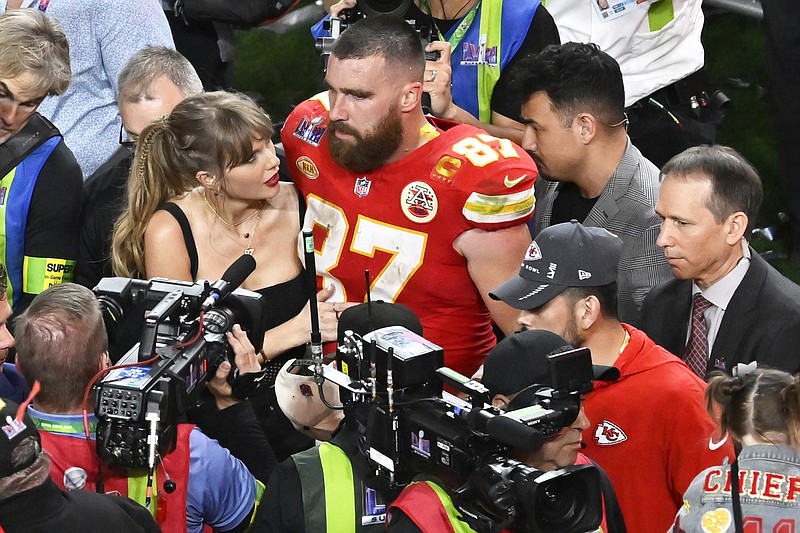 Chiefs tight end Travis Kelce embraces Taylor Swift after Sunday night's overtime win against the 49ers in Super Bowl 58 in Las Vegas. (Associated Press)