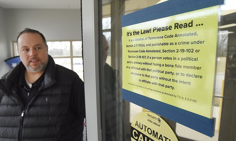 Staff photo by Matt Hamilton / Scott Allen looks at the sign posted at the Hamilton County Election Commission on Feb. 8.