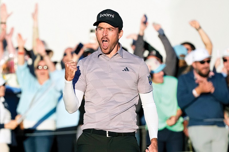 Nick Taylor celebrates after making a birdie putt on the 18th hole to force a playoff with Charley Hoffman during Sunday’s final round of the Phoenix Open in Scottsdale, Ariz. (Associated Press)