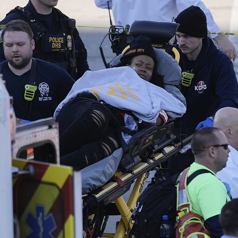 A person is taken to an ambulance after a shooting following the Kansas City Chiefs victory parade Wednesday in Kansas City, Mo. 
(AP/Charlie Riedel)