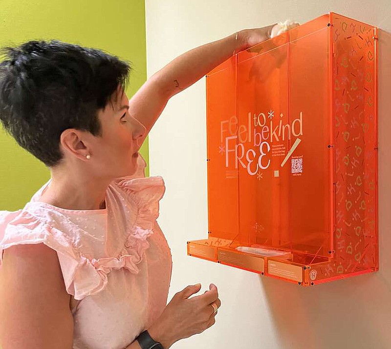There's very little sexual education in Arkansas, said researcher Dina Benbrahim. And with new laws that are queer phobic and trans phobic, it's even harder to talk about menstruation as it touches this demographic. The design of a period product dispenser at the Medium is meant to combat those attitudes. Its opaque look is meant to convey transparency. The orange neon color is purposefully something hard to ignore. “It's there in your face, it's about menstruation and in that context, celebrated,” she said. (Courtesy photos).