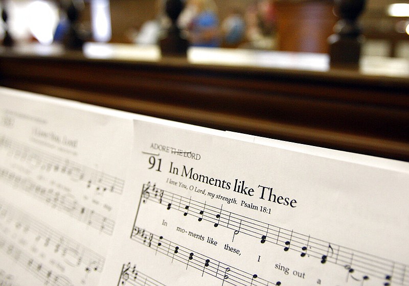 Music sheets for "In Moments like These" are seen atop an organ before a church service in this June 27, 2010 file photo. (AP/Patrick Semansky)