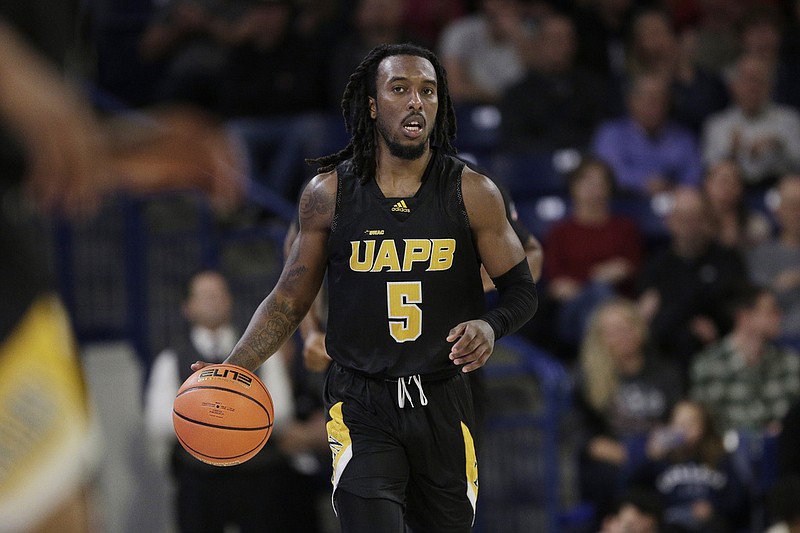 Rashad Williams, a guard with the University of Arkansas at Pine Bluff, controls the ball during the second half against Gonzaga during a UAPB road game in Spokane, Wash., in this Dec. 5, 2023 file photo. (AP/Young Kwak)