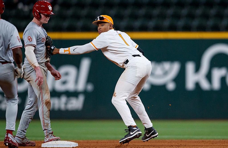 Tennessee Athletics photo / Tennessee shortstop Christian Moore tags a pair of Oklahoma baserunners to complete a triple play during Saturday night’s extra-inning loss to the Sooners.