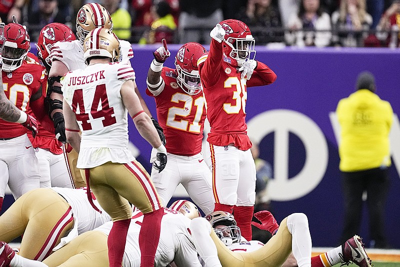 Chiefs cornerback L'Jarius Sneed (38) and safety Mike Edwards (21) celebrate a fumble recovery during last Sunday night's Super Bowl against the 49ers in Las Vegas. (Associated Press)