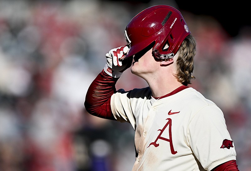 Arkansas catcher Hudson White (8) reacts after being forced out, Sunday, February 18, 2024 during the seventh inning of a baseball game at Baum-Walker Stadium in Fayetteville. Visit nwaonline.com/photos for today's photo gallery...(NWA Democrat-Gazette/Charlie Kaijo)
