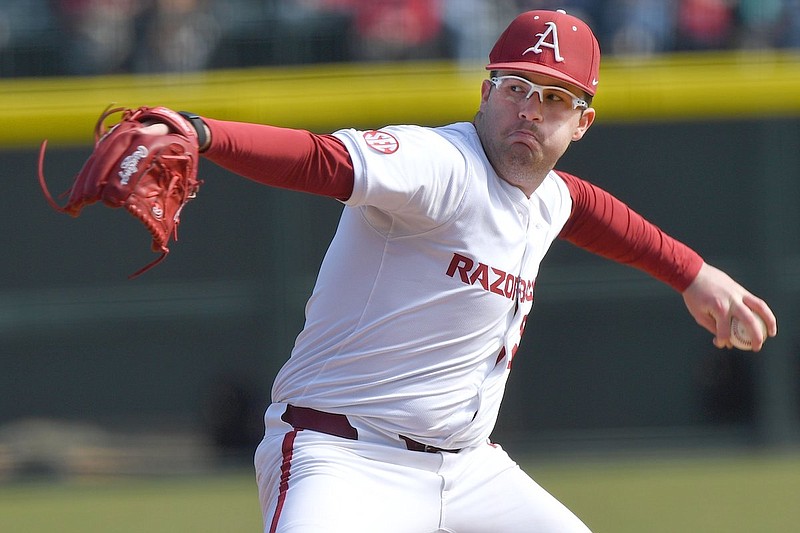Arkansas starter Colin Fisher delivers a pitch Monday, Feb. 19, 2024, during the second inning of the Razorbacks' 4-0 win over James Madison at Baum-Walker Stadium in Fayetteville. (Andy Shupe/NWA Democrat-Gazette)