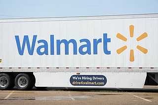 FILE - A tractor trailer bearing the Walmart logo seen in Richland, Miss., Sept. 6, 2023. (AP Photo/Rogelio V. Solis, file)