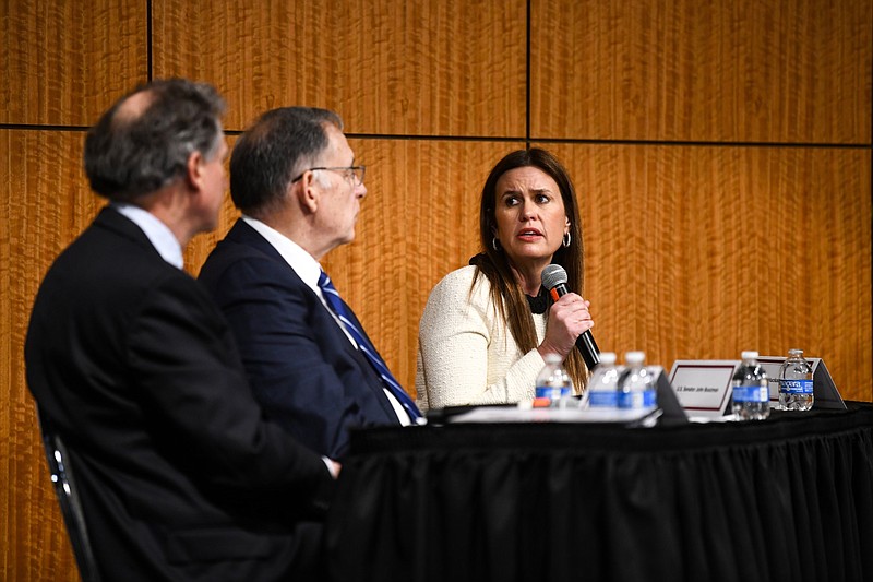 Arkansas Gov. Sarah Huckabee Sanders (right) discusses maternal health in Arkansas during a roundtable discussion at the University of Arkansas for Medical Sciences in Little Rock as (from left) U.S. Rep. French Hill and U.S. Sen. John Boozman, both R-Ark., listen. (Arkansas Democrat-Gazette/Stephen Swofford)