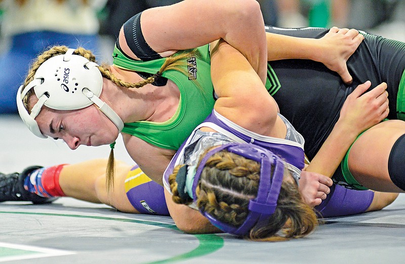 In this Dec. 14, 2022, file photo, Brookelynn Meeks of Blair Oaks tries to pin Hallsville’s Izzy Lopez on her back during their 130-pound match in the Blair Oaks Tournament at Blair Oaks High School in Wardsville. (News Tribune file photo)