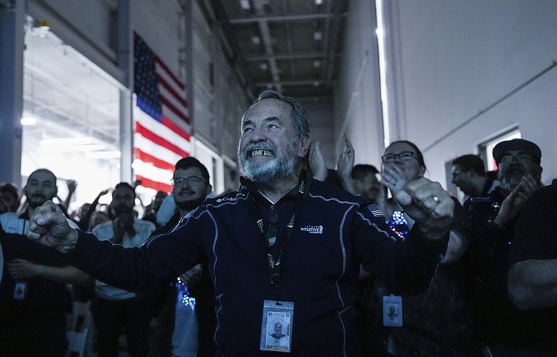 Dan Harrison, main engine control computer designer for Intuitive Machines, cheers among fellow employees during a watch party moments after they became the first commercial company to softly land on the moon Friday in Houston.
(AP/Houston Chronicle/Raquel Natalicchio)