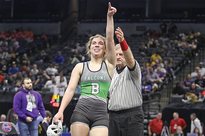 Brookelynn Meeks points to the Blair Oaks cheering section in celebration after winning a 130-pound quarterfinal match by major decision against Affton’s Issac Hudson, clinching a state medal Wednesday afternoon in the Class 1 girls wrestling state championships at Mizzou Arena in Columbia. (Greg Jackson/News Tribune)