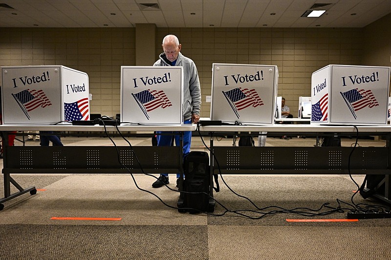 Charles Bausch votes in the primary at Laman Library in North Little Rock during early voting on Friday, Feb. 23, 2024. (Arkansas Democrat-Gazette/Stephen Swofford)