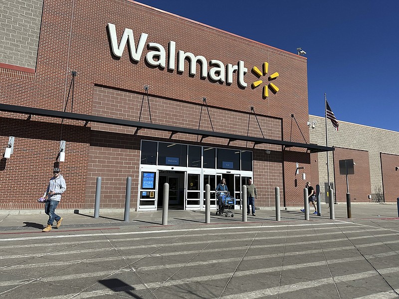 Shoppers exit a Walmart store Wednesday in Englewood, Colo.
(AP/David Zalubowski)