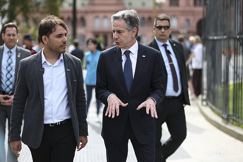 U.S. Secretary of State Antony Blinken (center) speaks with an unidentified official Friday as he walks outside Casa Rosada presidential palace in Buenos Aires, Argentina.
(AP/Agustin Marcarian)