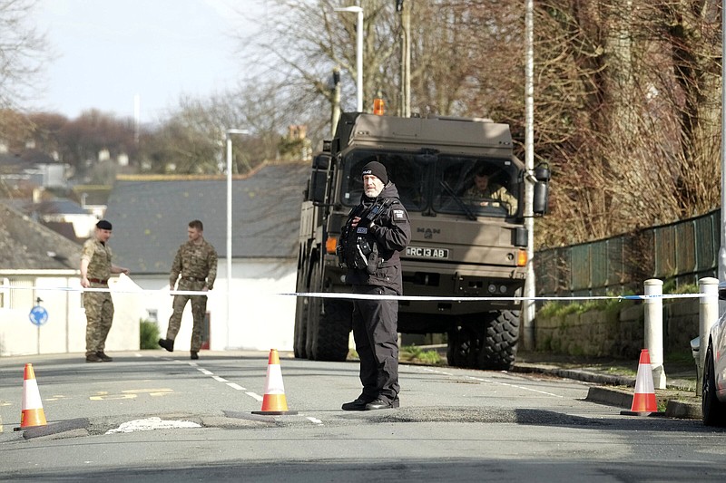 Police and bomb disposal experts stand near St Michael Avenue, where residents had been evacuated and a cordon put in place after the discovery of a suspected World War II explosive device, Friday in Plymouth, England.
(AP/PA/Matt Keeble)