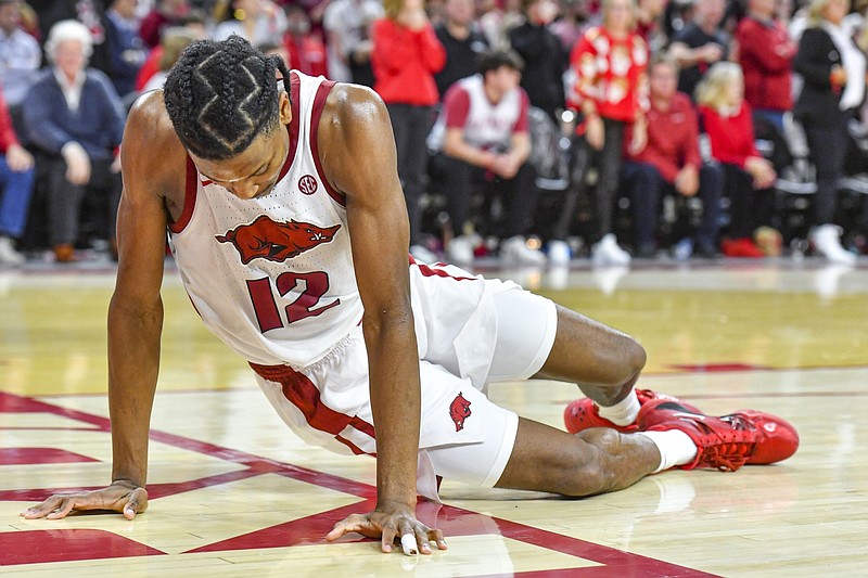 Arkansas guard Tramon Mark (12) reacts after suffering an injury during the second half of the Kentucky Wildcats’ 63-57 win over the Razorbacks at Bud Walton Arena in Fayetteville in this Jan. 27, 2024 file photo. (NWA Democrat-Gazette/Hank Layton)