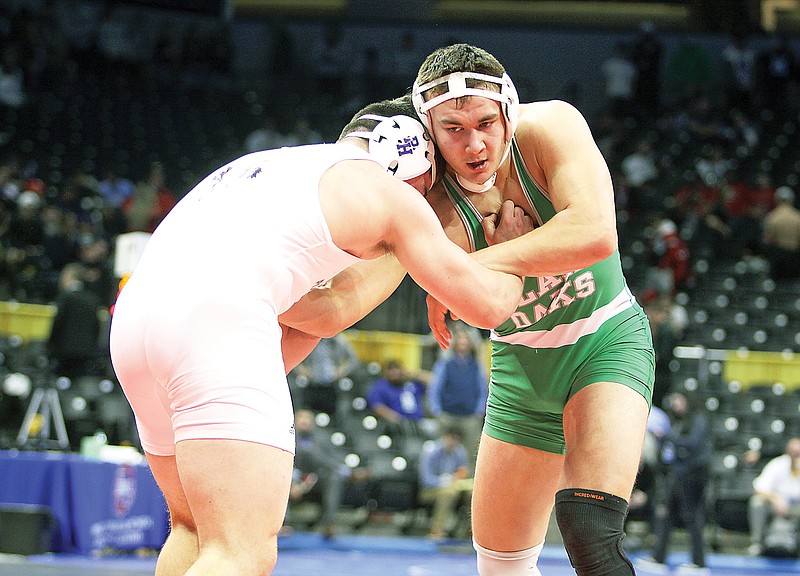 Brady Kerperin of Blair Oaks battles against Pleasant Hill’s Brayden Bush during their 215-pound title match Thursday night in the Class 2 boys wrestling state championships at Mizzou Arena. (Greg Jackson/News Tribune)
