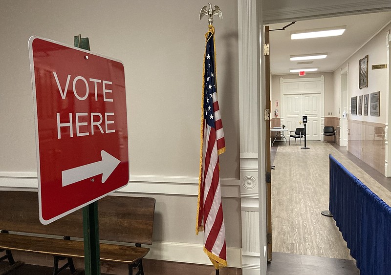 The arrow points the way to the voting machines in Pine Bluff during early voting on Friday, Feb. 23, 2024. (Pine Bluff Commercial/Byron Tate)