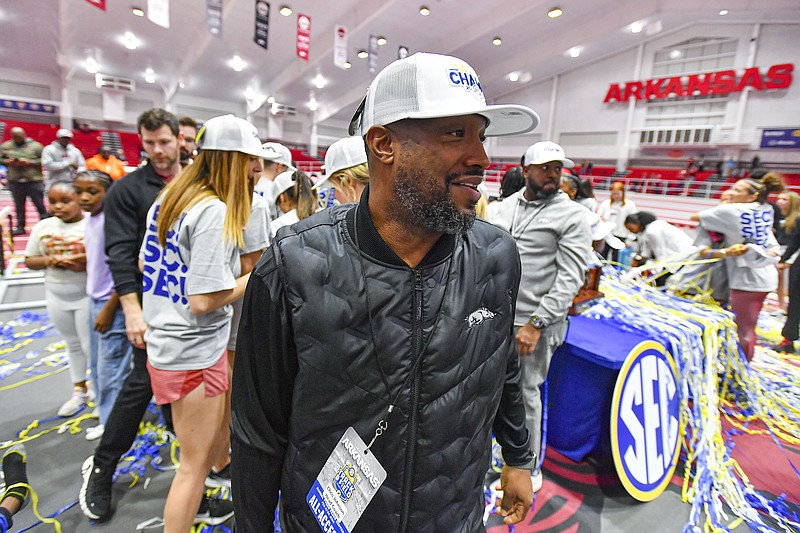 Arkansas head women’s track and field coach Chris Johnson celebrates with the team, Saturday, Feb. 24, 2024, following the Razorbacks’ sweep at the 2024 SEC Indoor Track and Field Championships inside the Randal Tyson Track Center in Fayetteville. Visit nwaonline.com/photo for today's photo gallery..(NWA Democrat-Gazette/Hank Layton)