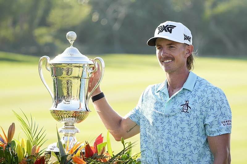 Jake Knapp, of the United States, poses with his trophy during the award ceremony after winning the Mexico Open golf tournament in Puerto Vallarta, Mexico, Sunday, Feb. 25, 2024. (AP Photo/Fernando Llano)