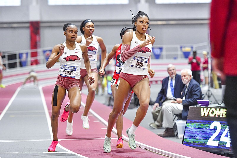 Arkansas’ Amber Anning (right), Nickisha Pryce (left) and Joanne Reid (center) compete in the women’s 400 meters, Saturday, Feb. 24, 2024, at the 2024 SEC Indoor Track and Field Championships inside the Randal Tyson Track Center in Fayetteville. Visit nwaonline.com/photo for today's photo gallery..(NWA Democrat-Gazette/Hank Layton)