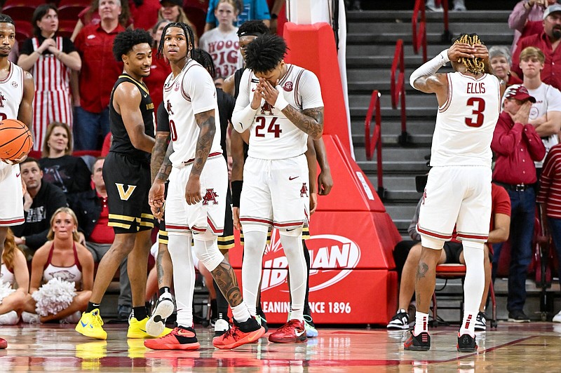 Arkansas players Khalif Battle (0), Jeremiah Davenport (24), and El Ellis (3) react to a missed rebound late in the second half on Tuesday, Feb. 27, 2024, at Bud Walton Arena in Fayetteville. The Arkansas Razorbacks hosted the Vanderbilt Commodores in a conference matchup. Visit nwaonline.com/photo for today's photo gallery.(NWA Democrat Gazette/Caleb Grieger)