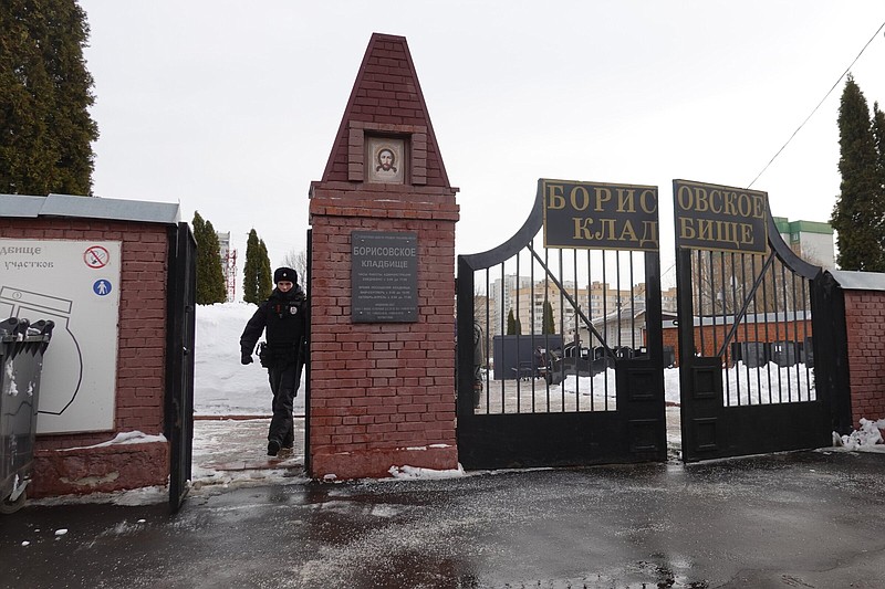 A policeman walks through the gate of the cemetery on Wednesday, where the funeral of Russian opposition leader Alexei Navalny will be held on Friday.
(AP)