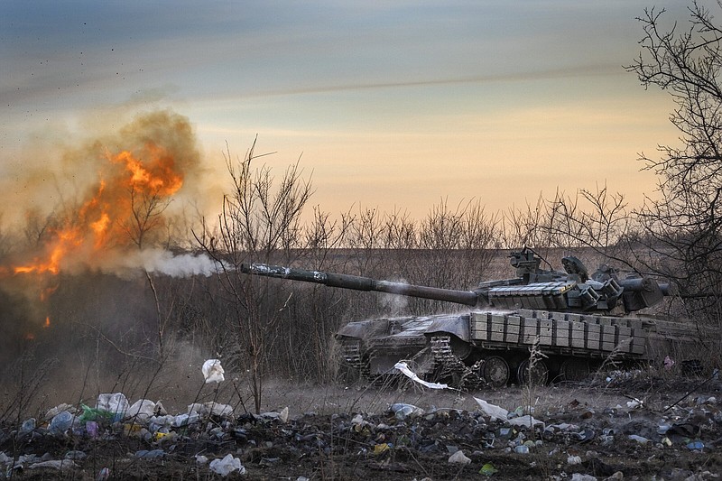 A Ukrainian tank fires at Russian positions in Chasiv Yar, the site of fierce battles with Russian troops, in the Donetsk region, Ukraine, on Thursday. More photos at arkansasonline.com/ukrainemonth25/.
(AP/Efrem Lukatsky)