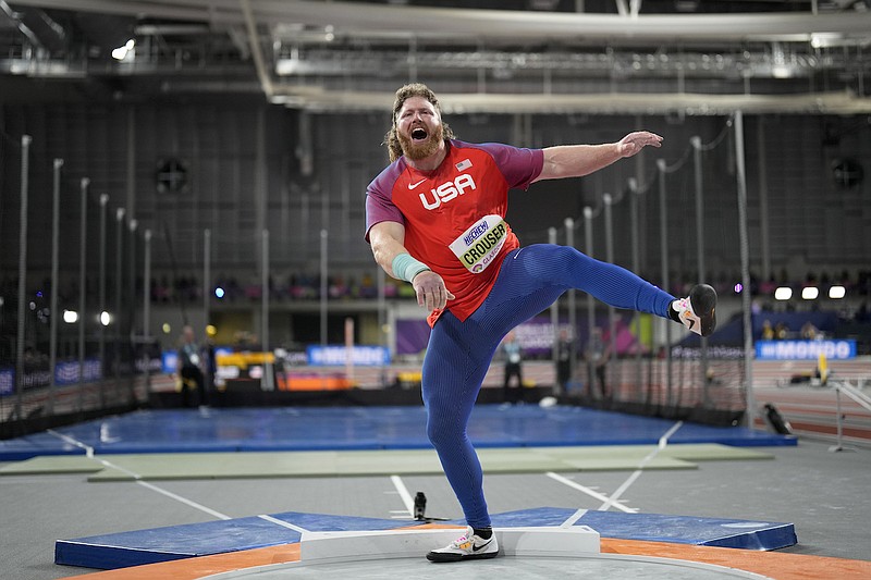 Ryan Crouser, of the United States, makes an attempt in the men's shot put during the World Athletics Indoor Championships at the Emirates Arena in Glasgow, Scotland, Friday, March 1, 2024. (AP Photo/Bernat Armangue)