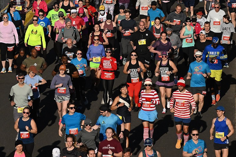 Participants in the 2023 Little Rock Marathon take off from the starting line in downtown Little Rock in this March 5, 2023 file photo. (Arkansas Democrat-Gazette/Staci Vandagriff)