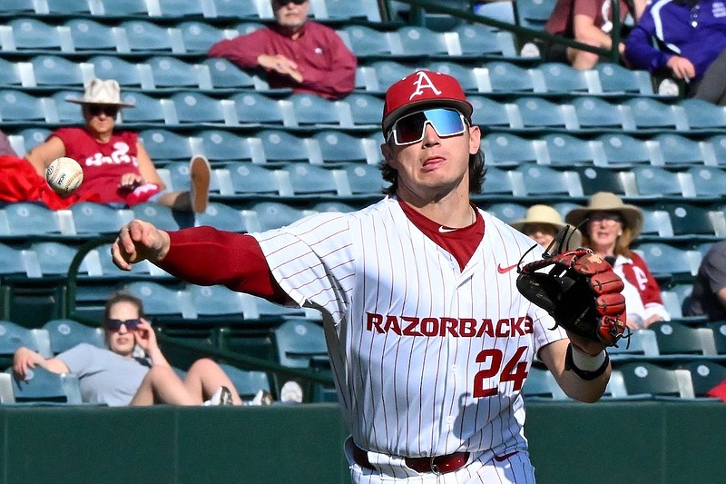Arkansas third baseman Peyton Holt throws toward first base during a game against Central Arkansas on Tuesday, March 5, 2024, in Fayetteville. (Caleb Grieger/NWA Democrat-Gazette)