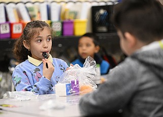 Jade Flores Morales eats her breakfast in this 2024 file photo. (Arkansas Democrat-Gazette/Staci Vandagriff)