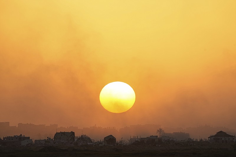 The sun sets over the Gaza Strip as seen from southern Israel, Monday, March 4, 2024. (AP Photo/Ohad Zwigenberg)