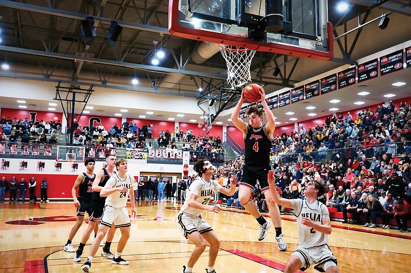 Jefferson City's Brody Johns catches the ball during Tuesday night’s Class 5 District 5 Tournament championship game against Helias at Fleming Fieldhouse. (Alexa Pfeiffer/News Tribune)