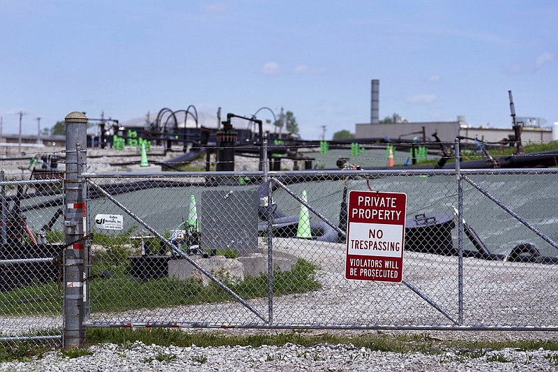 A no trespassing sign hangs on a fence around the West Lake Landfill Superfund site in Bridgeton, Mo., in April 2023.
(AP/Jeff Roberson)