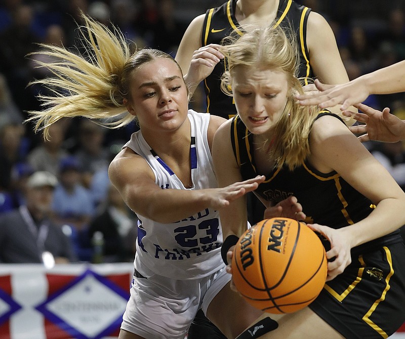 Bergman’s Brinley Collins (left) fights for a rebound with Salem’s Montana Franks during the third quarter of the Panthers’ 56-33 victory in the Class 3A girls state championship game at Bank OZK Arena in Hot Springs. More photos at arkansasonline.com/38girls3a24/.
(Arkansas Democrat-Gazette/Thomas Metthe)