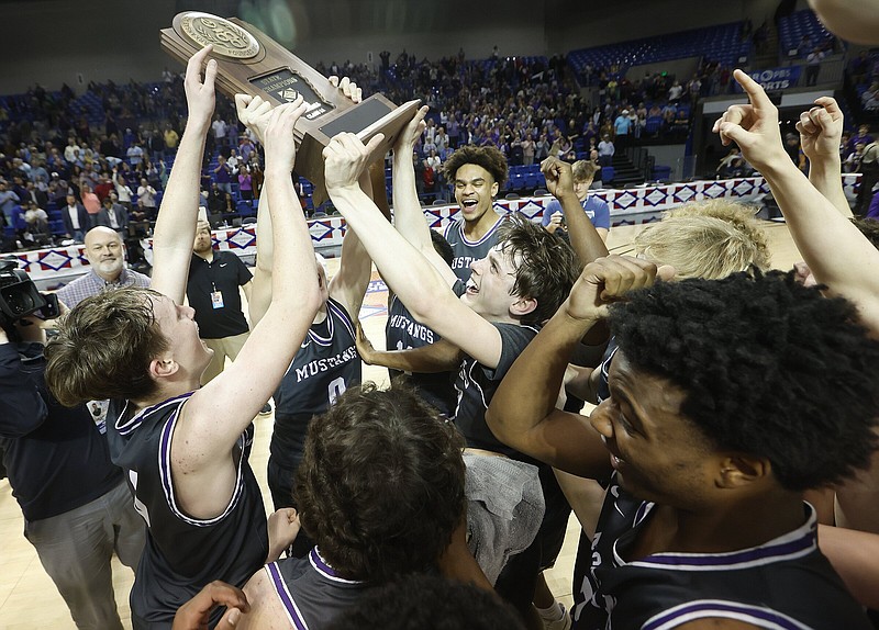 Central Arkansas Christian players celebrate their 57-47 victory over Bergman on Thursday in the Class 3A boys state championship game at Bank OZK Arena in Hot Springs. More photos at arkansasonline.com/38boys3a24/.
(Arkansas Democrat-Gazette/Thomas Metthe)