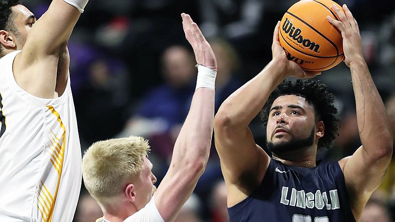 Lincoln's Elijah Farr puts up a shot against a pair of Fort Hays State defenders during Thursday night's MIAA Tournament quarterfinal game at Municipal Auditorium in Kansas City. (Courtesy of Lincoln Athletics)